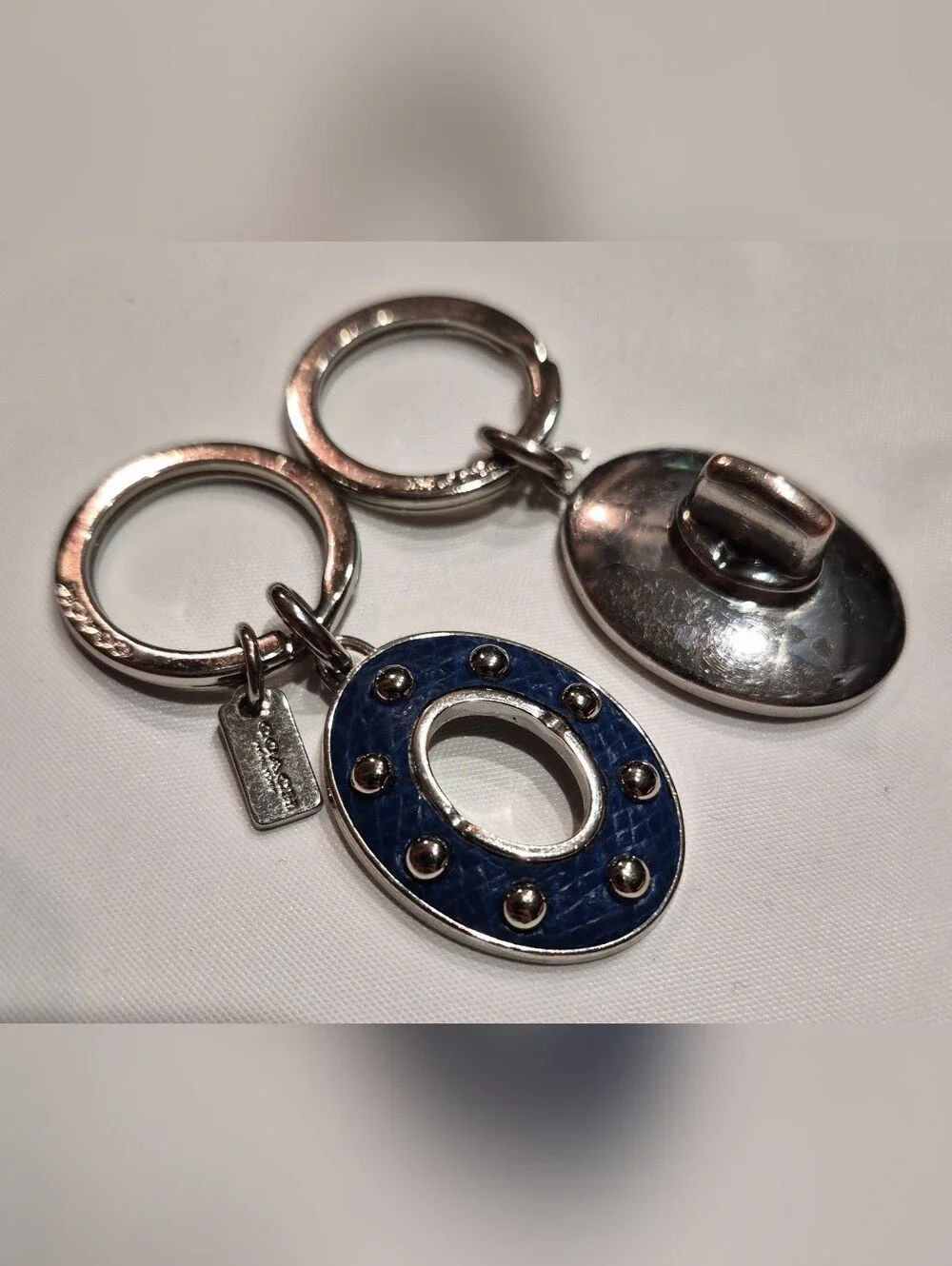 Coach Studded Leather Turnlock Keychain